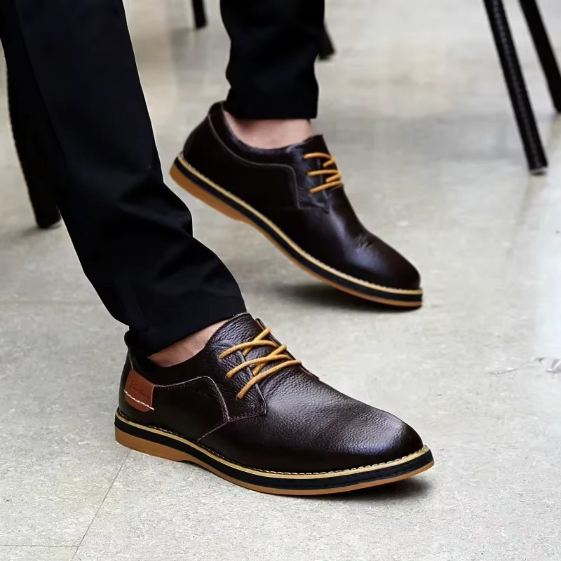 Men's genuine leather moccasins in dark brown with stylish tan laces, perfect for casual elegance and versatile looks.